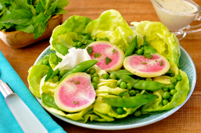 Spring into spring with the delicious pea salad topped with a no-oil miso almond milk dressing.