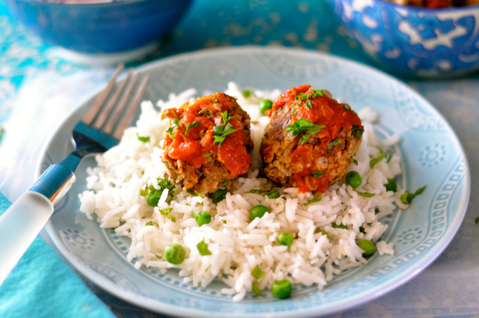 Vegan meatballs over basmati rice and peas smothered in tomato sauce. (#vegan) ordinaryvegan.net