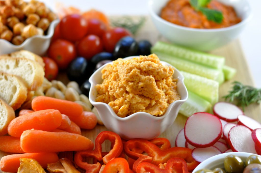 Minty romesco dip, cauliflower hummus, spicy garbanzo beans, nuts, dried fruit and fresh vegetables make these vegan appetizers stand-out. (#vegan) ordinaryvegan.net