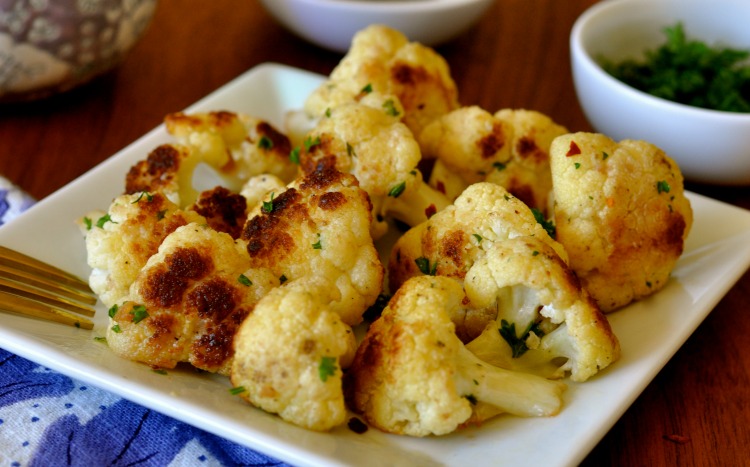 This cauliflower recipe explodes with flavor from a simple yet extraordinary profile of flavors including garlic, vinegar and parsley.(#vegan) www.ordinaryvegan.net
