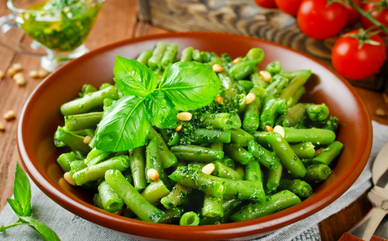 Pink and green colored string beans background. Vegetarian food